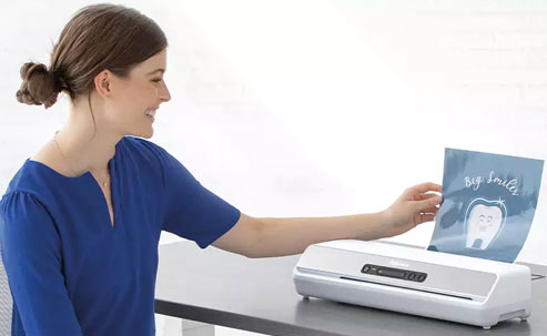 Woman using a laminator