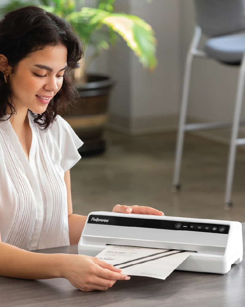 Woman using a laminator